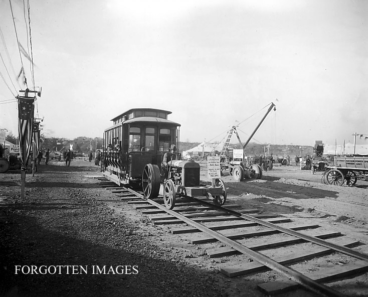 TROLLEY PULLED BY TRACTOR INTO TRAINYARD 1910s.jpg