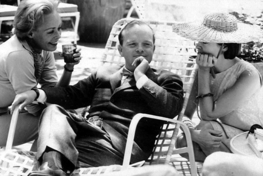 Truman Capote assumes the center of attention.JPG