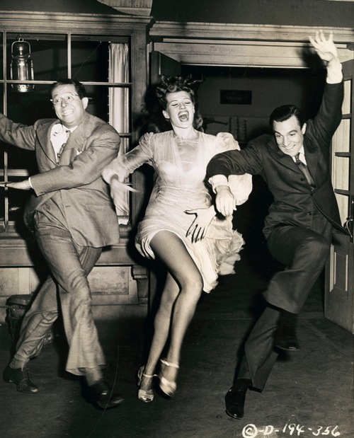 Actress Rita Hayworth (1918-1987), with actors Gene Kelly (1912-1996) and Phil Silver (1911-1985), on the set of Charles Vidor’s film, “Cover Girl,” 1944..jpg