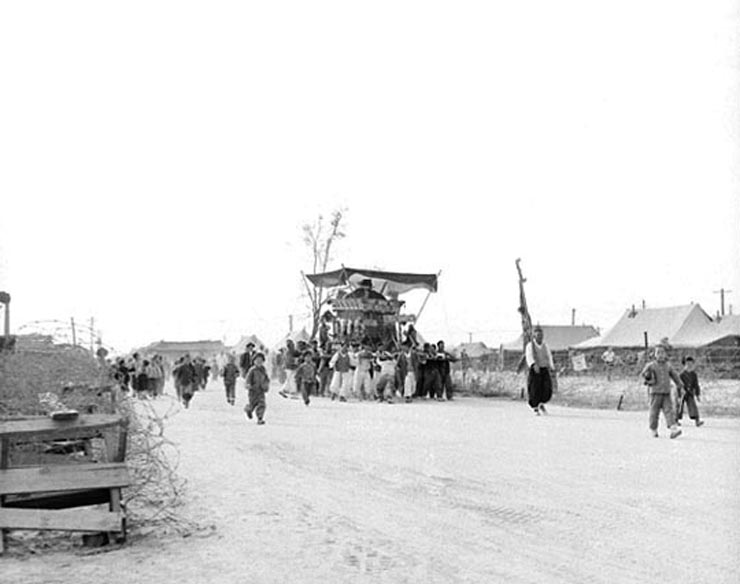 19Traditional Korean funeral passing the 326th CRC compound. Fall 1952. Korea.jpg