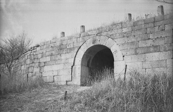 Gate in a wall in the hills to the north of Seoul, Korea. 1952.jpg