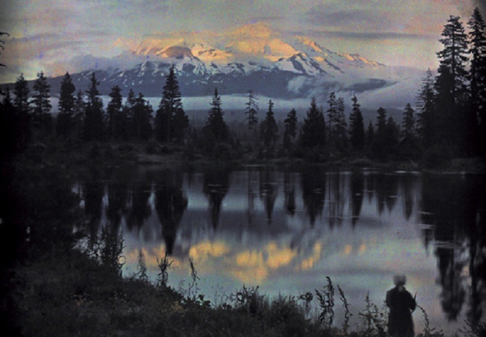 California-A-woman-stands-at-the-edge-of-a-pond-observing-the-view-near-Mount-Shasta.jpg