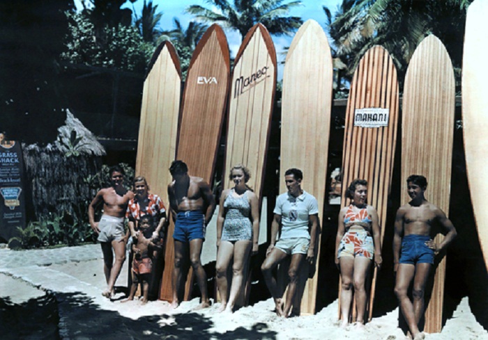 Hawaii-A-group-of-surfers-on-Waikiki-beach-pose-leaning-against-their-boards-Honolulu-Oahu-Island.jpg