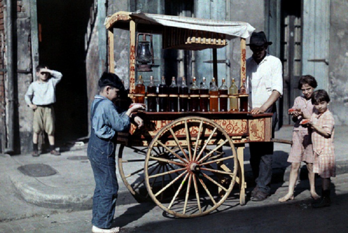 Louisiana-Children-gather-by-a-vendor-selling-snowball-treats-New-Orleans.jpg