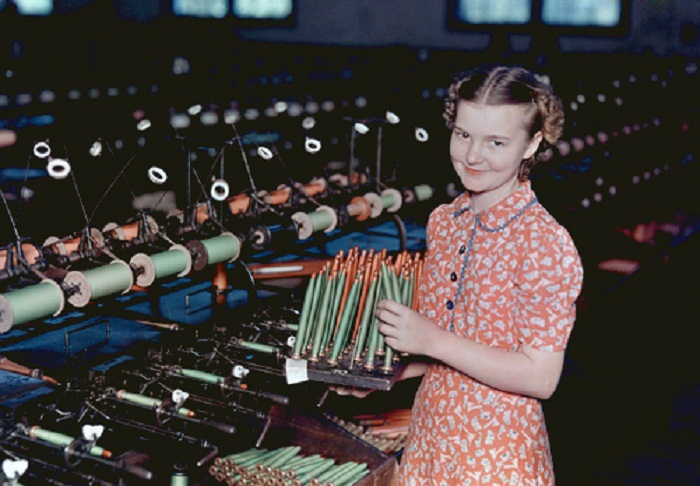Mississippi-A-young-girl-removes-raw-fiber-from-spools-to-spindles-for-weaving-Hattiesburg.jpg
