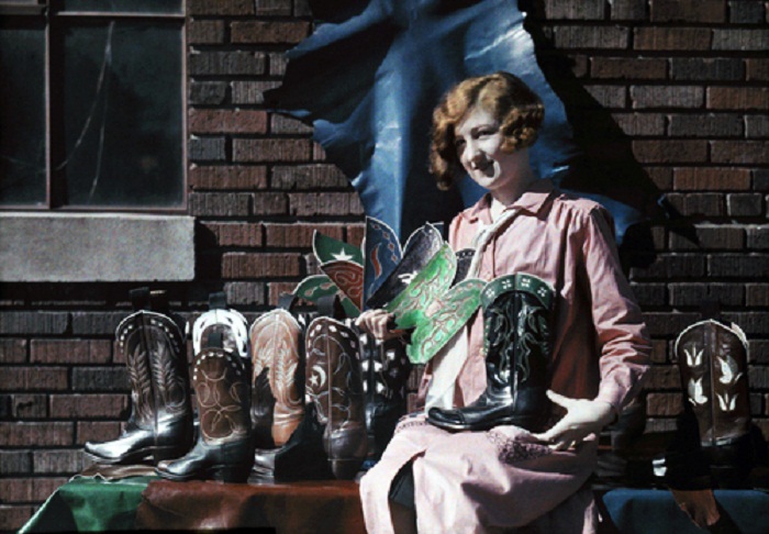Texas-A-woman-displays-varying-stock-models-of-a-cowboy-boot-manufacturer-Forth-Worth-Texas.jpg