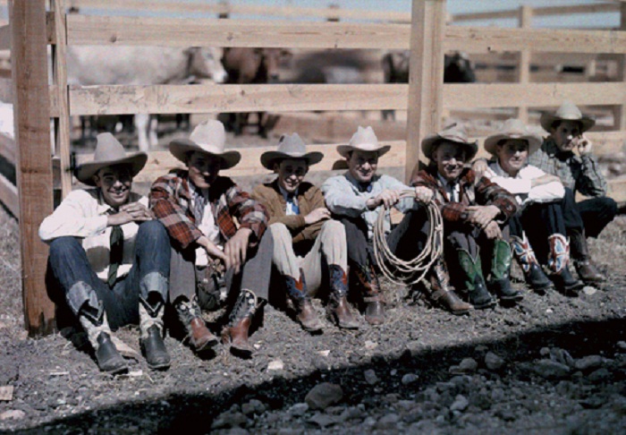 Texas-Cowboys-and-riders-sit-along-a-fence-at-the-San-Antonio-Rodeo.jpg