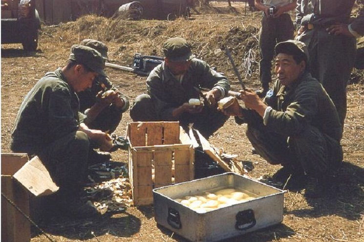 Koreans peeling potatoes-Forward 46th ASH-April 1953.JPG