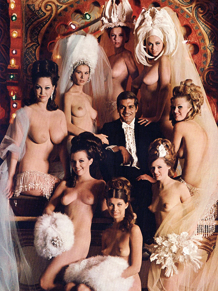 Omar Sharif; surrounded by Ziegfeld Follies girls, from William Wyler’s Funny Girl (1968); pictorial from Playboy magazine, December 1968..jpg