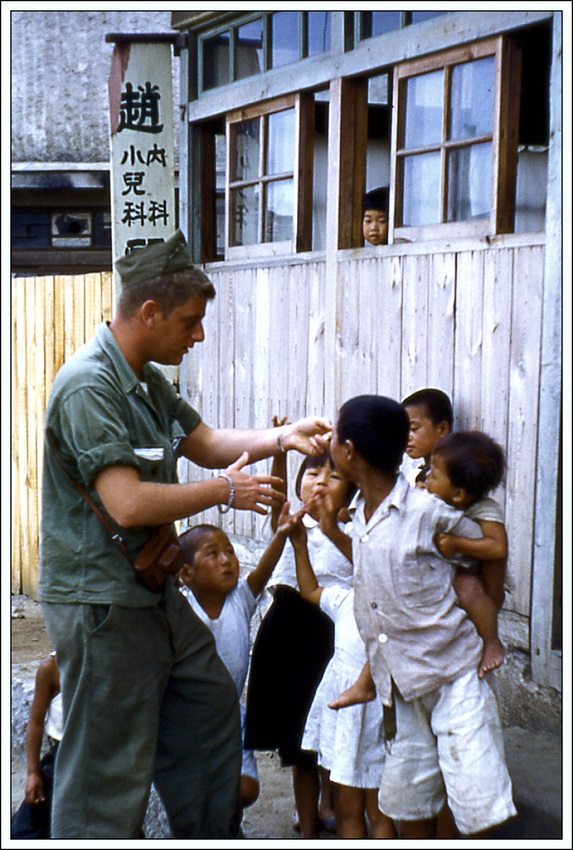 192KB - Kangnung - Giving candy to children 2 - Korea 1953.jpg