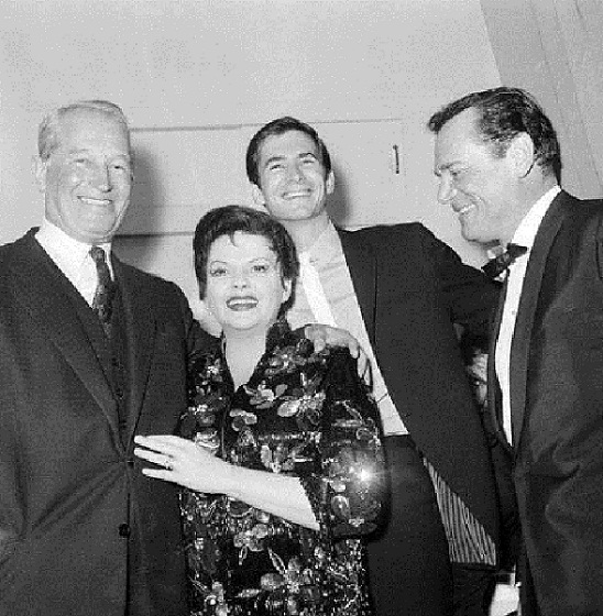 Maurice Chevalier, Judy Garland, Anthony Perkins and Eddie Constantine.jpg