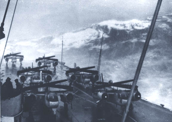A giant wave about to sweep over the decks of the HMCS Bonaventure.  Several planes were washed into the ocean and four destroyer escorts were also damaged..jpg