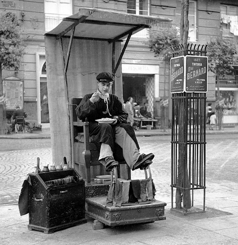 A shoeshine lunch break, Naples, Italy, ca 1950.jpg
