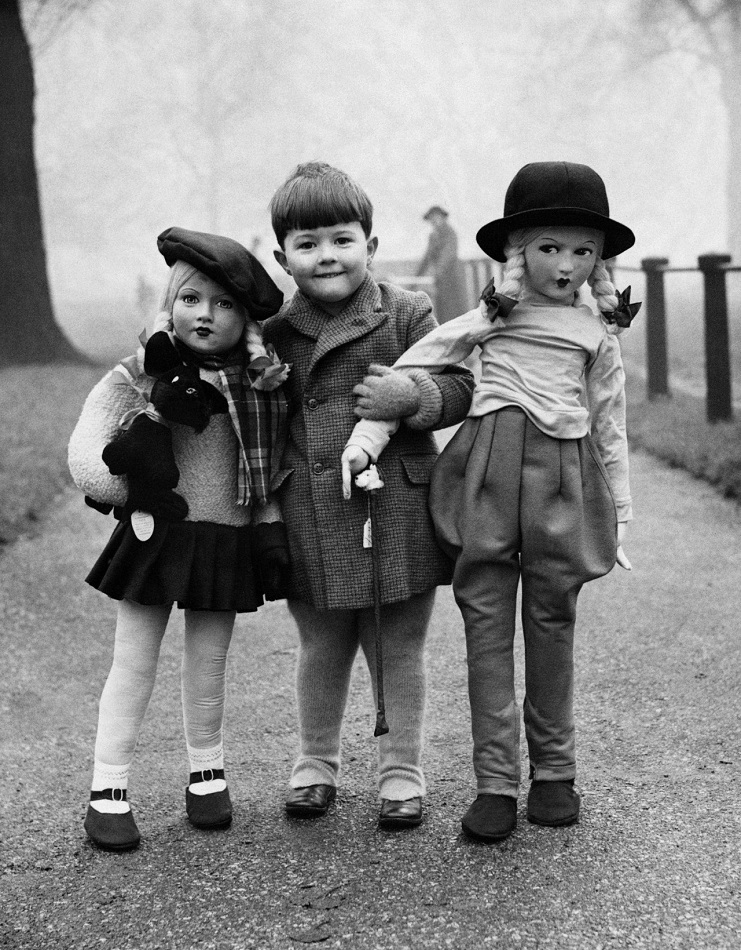 Boy with two large dolls, c. 1950’s, by Elliott Erwitt.jpg
