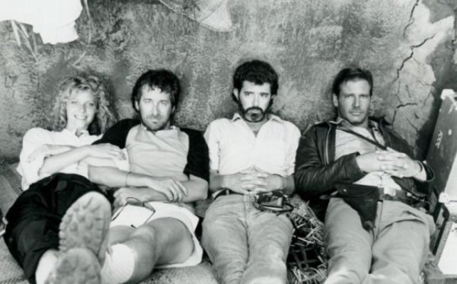 Kate Capshaw, Steven Spielberg, George Lucas and Harrison Ford on the set of Indiana Jones and the Temple of Doom (1984).jpg