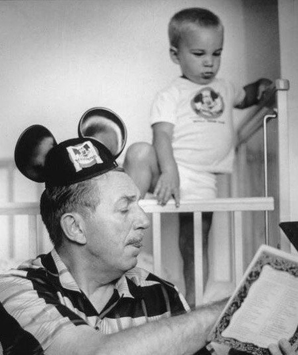 Walt Disney reading a bedtime story to his grandson, 1955.jpg