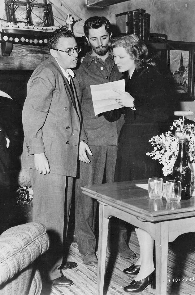 4f Director George Cukor, Robert Mitchum and Greer Garson on the set of Desire Me, 1947.jpg