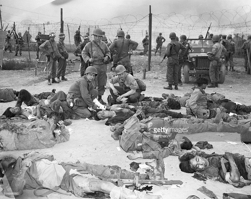 Soldiers Check Dead Korean Prisoners.jpg