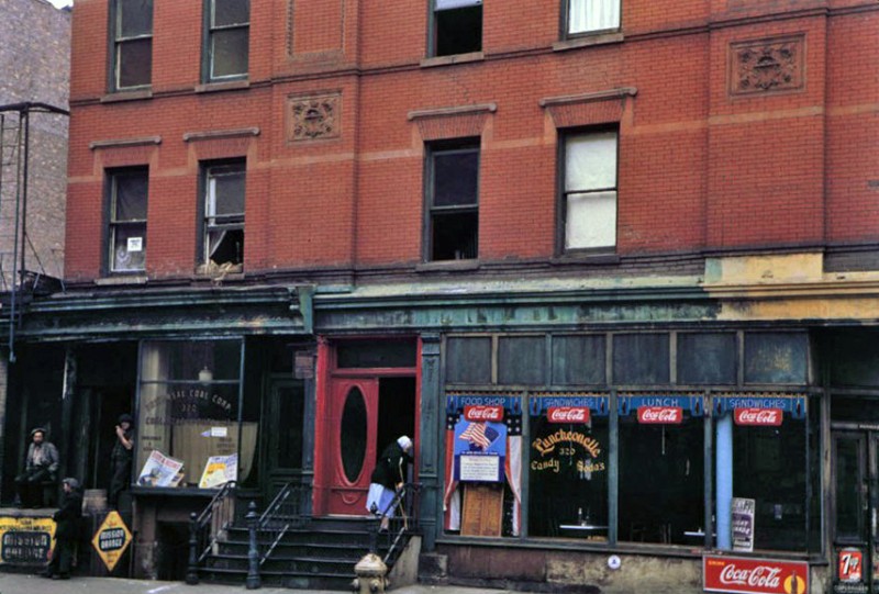 Store-fronts-below-brick-tenement-1942.jpg