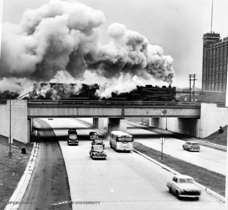 A steam engine passing over a highway in Detroit, 1950.jpg