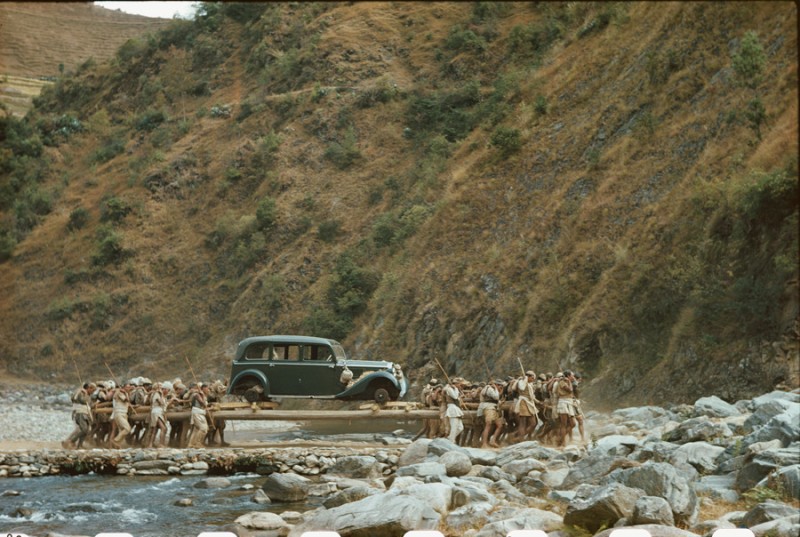 Native porters transport Rolls-Royce on poles across remote river in Nepal, January, 1950.jpg