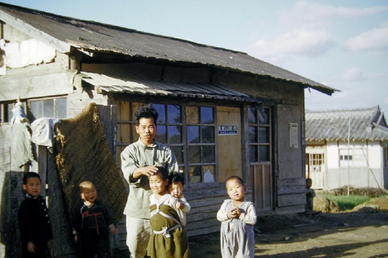 0019 Father &amp; Children in front of their home.jpg