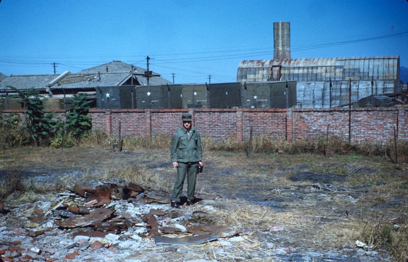14 Me on part of the bombed-out shoe factory ruins.jpg